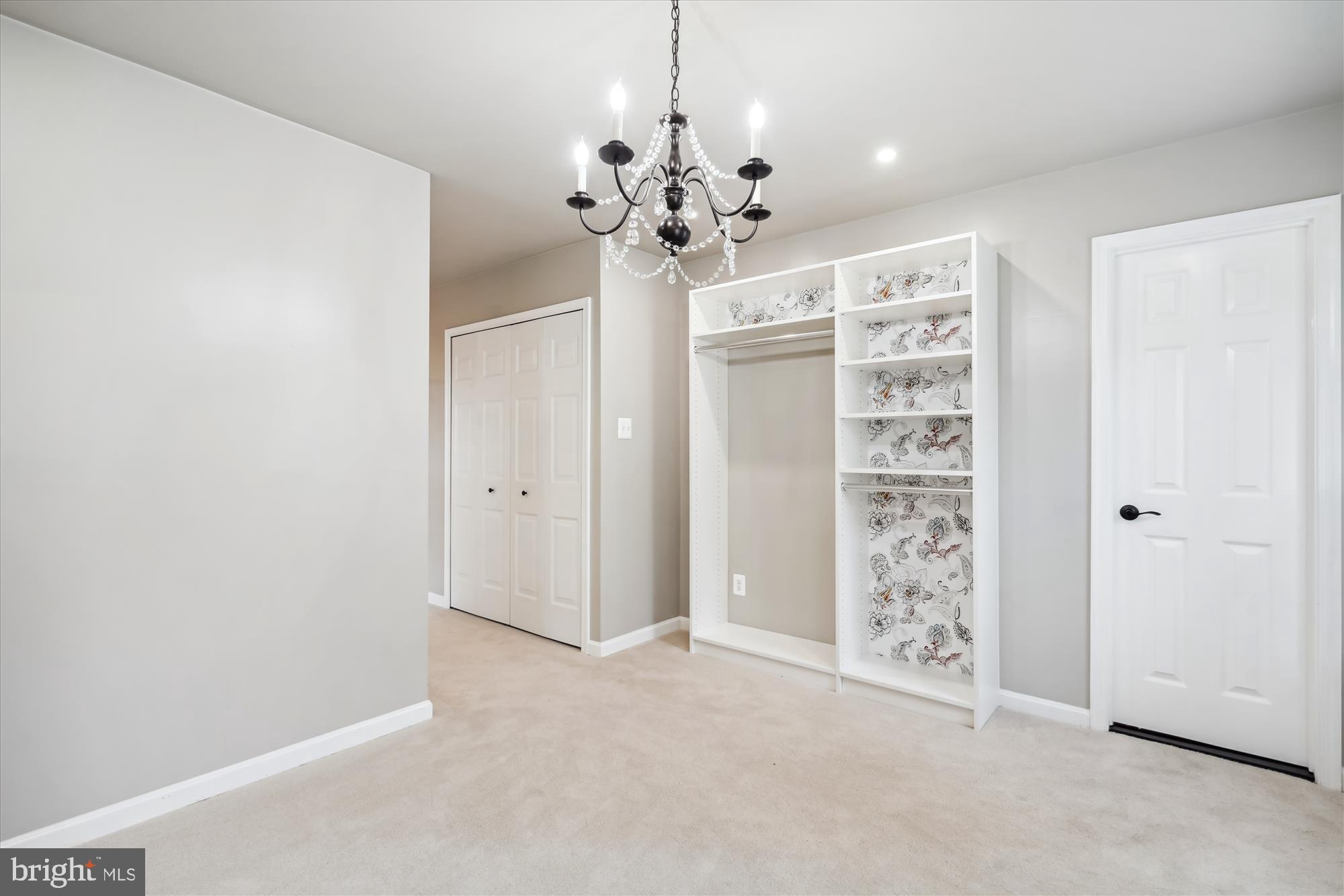2613 Mountain Laurel Place Reston, VA 20191 - Photo 31 of 78 a view of a chandelier in big room and chandelier