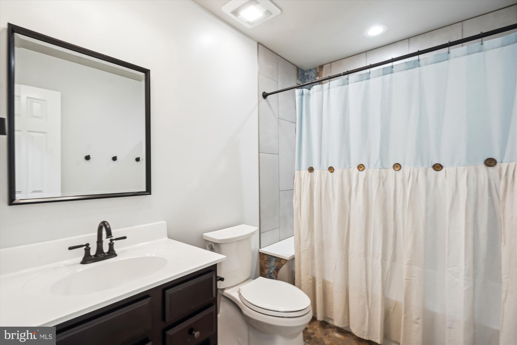 2613 Mountain Laurel Place Reston, VA 20191 - Photo 33 of 78 a bathroom with a sink a toilet and shower