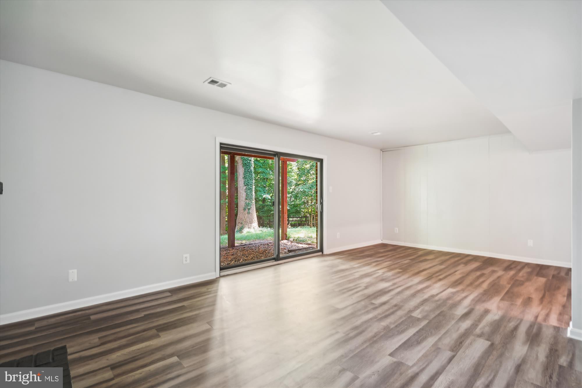 2613 Mountain Laurel Place Reston, VA 20191 - Photo 35 of 78 a view of an empty room with wooden floor and a window