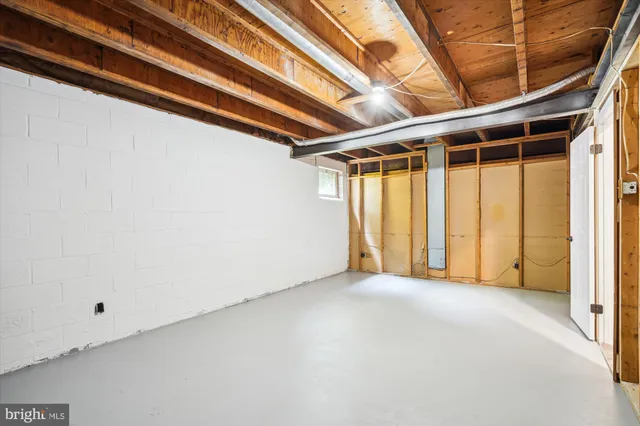 a view of a house with swimming pool and sitting area