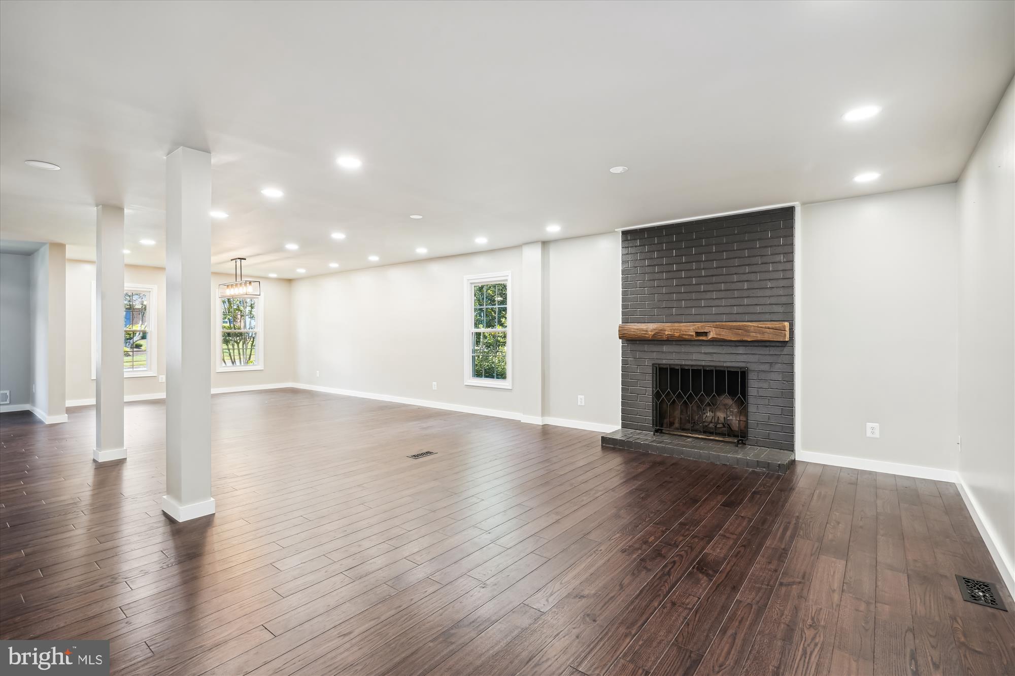 2613 Mountain Laurel Place Reston, VA 20191 - Photo 4 of 78 a view of an empty room with wooden floor and a fireplace