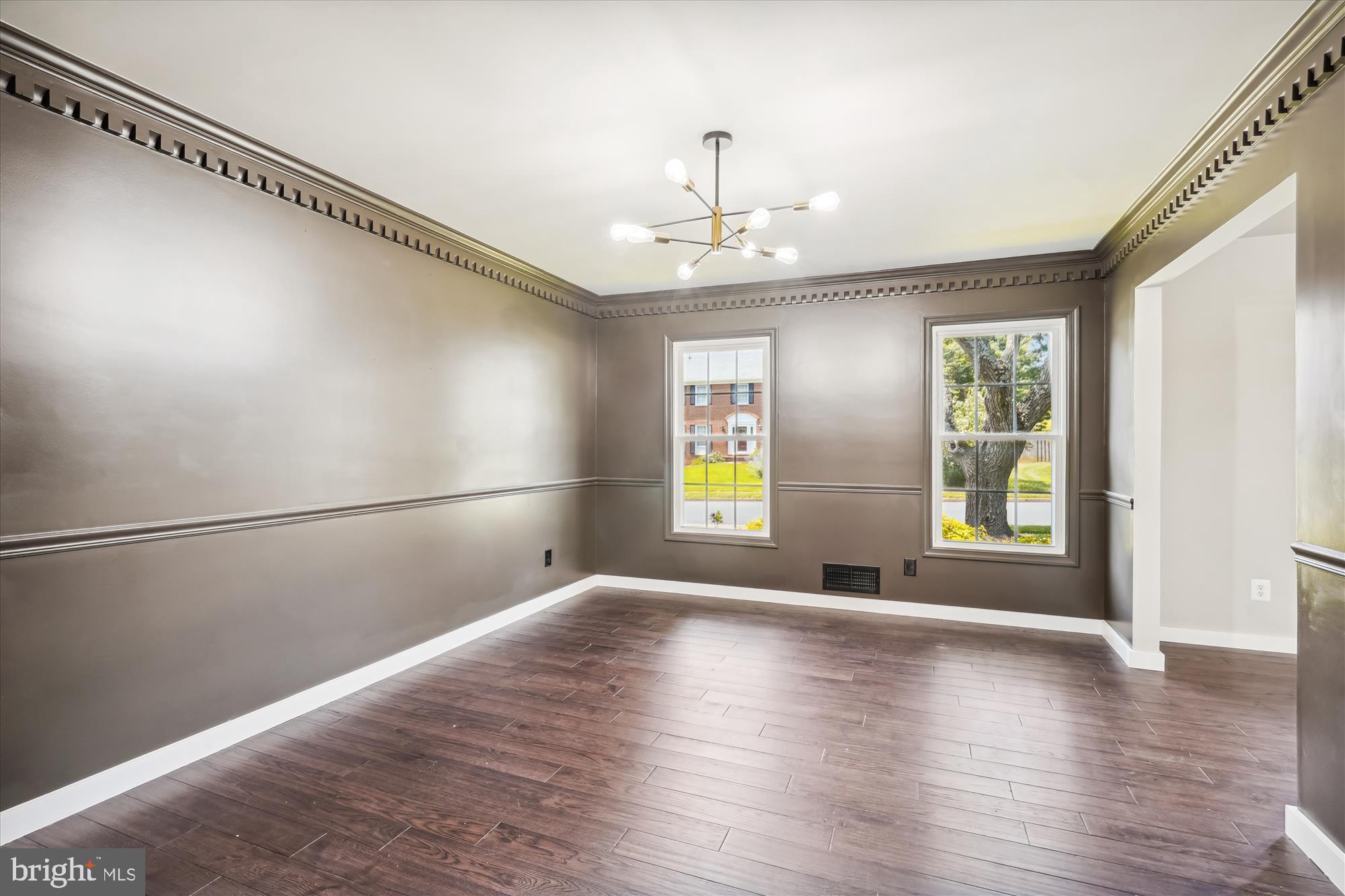 2613 Mountain Laurel Place Reston, VA 20191 - Photo 9 of 78 a view of an empty room with window and wooden floor