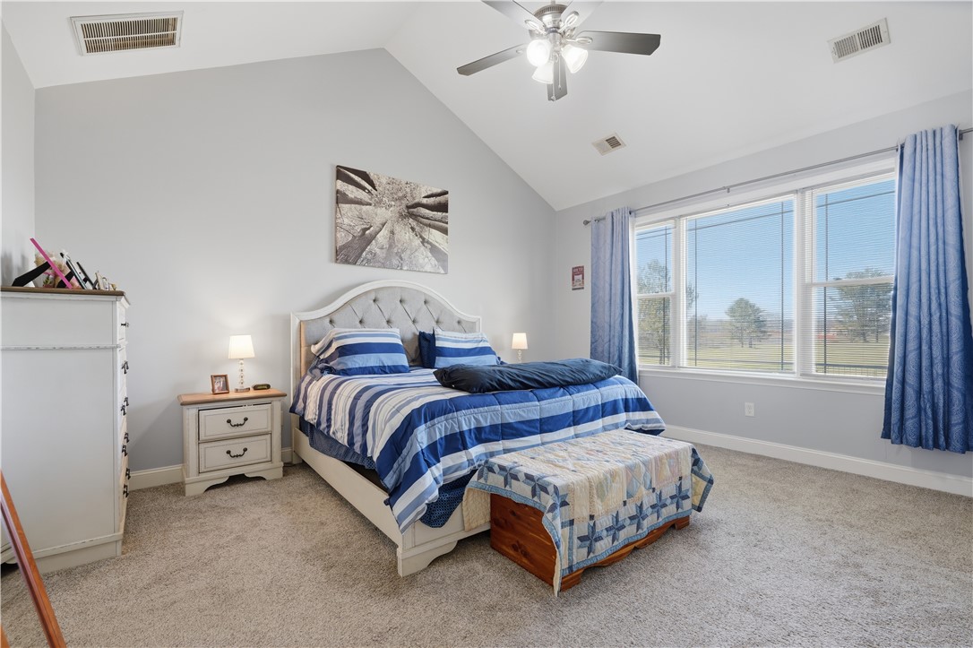 1312 Falcons Drive Walhalla, SC 29691 - Photo 13 of 34 This tranquil bedroom features vaulted ceilings and abundant natural light, offering a serene escape.