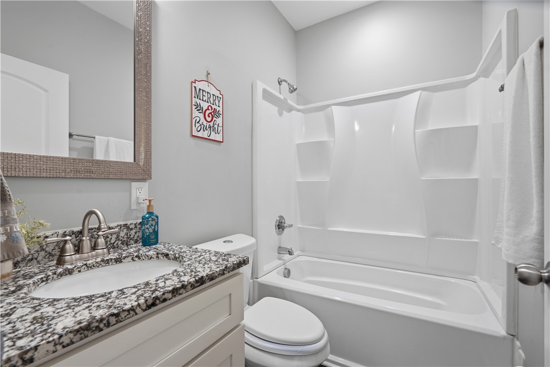 1312 Falcons Drive Walhalla, SC 29691 - Photo 18 of 34 This bright bathroom features a modern vanity and a functional shower-tub combination.