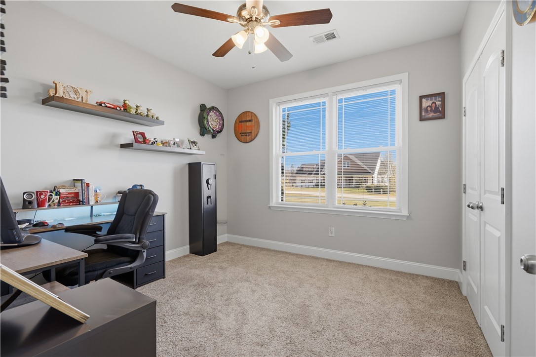 1312 Falcons Drive Walhalla, SC 29691 - Photo 20 of 34 This cozy room features soft carpeting and ample natural light, creating a bright and inviting atmosphere.