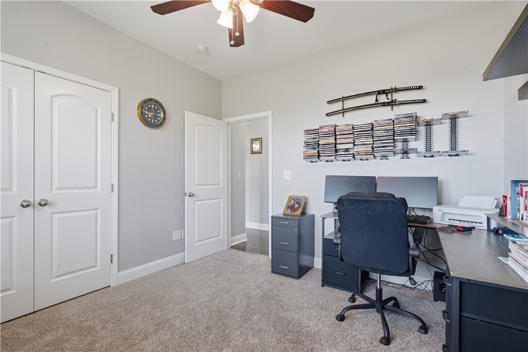 1312 Falcons Drive Walhalla, SC 29691 - Photo 21 of 34 This versatile room offers a comfortable workspace with soft carpeting and functional storage.