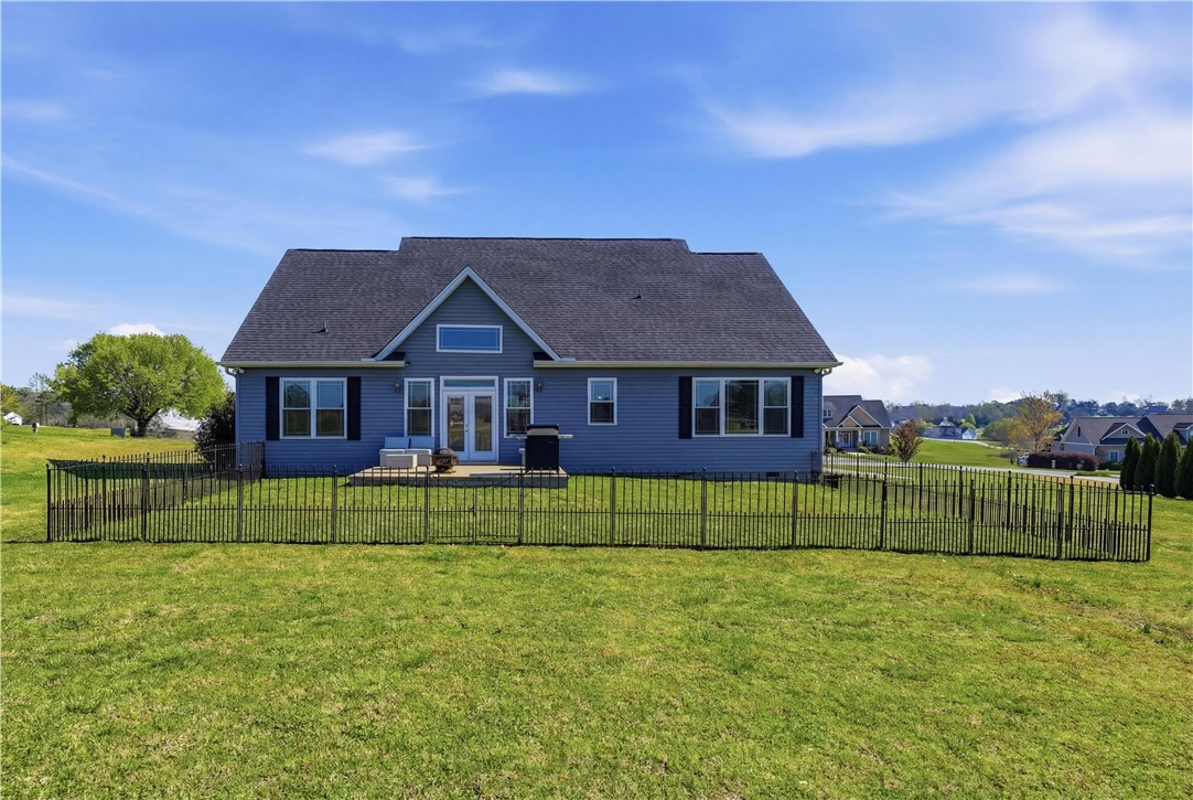 1312 Falcons Drive Walhalla, SC 29691 - Photo 24 of 34 This house features a charming rear patio and fenced backyard, perfect for outdoor enjoyment.