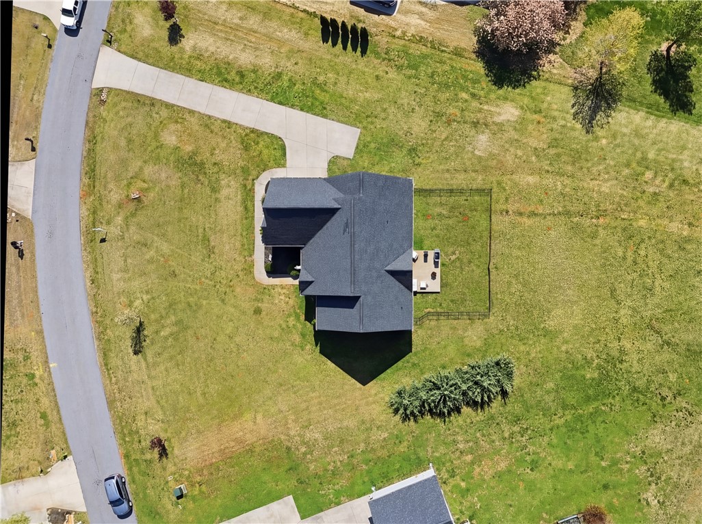 1312 Falcons Drive Walhalla, SC 29691 - Photo 27 of 34 Perched on a verdant lot, this residence offers a private fenced yard and expansive green spaces.