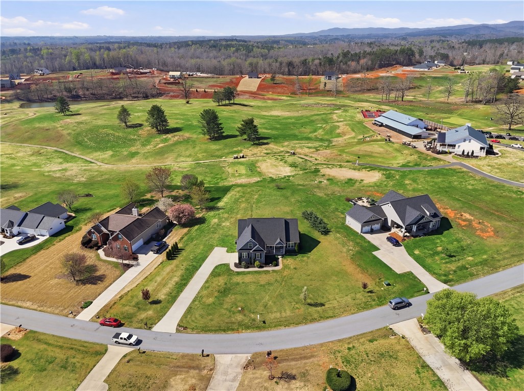 1312 Falcons Drive Walhalla, SC 29691 - Photo 30 of 34 This elevated view showcases a residential community with verdant surroundings and a golf course.