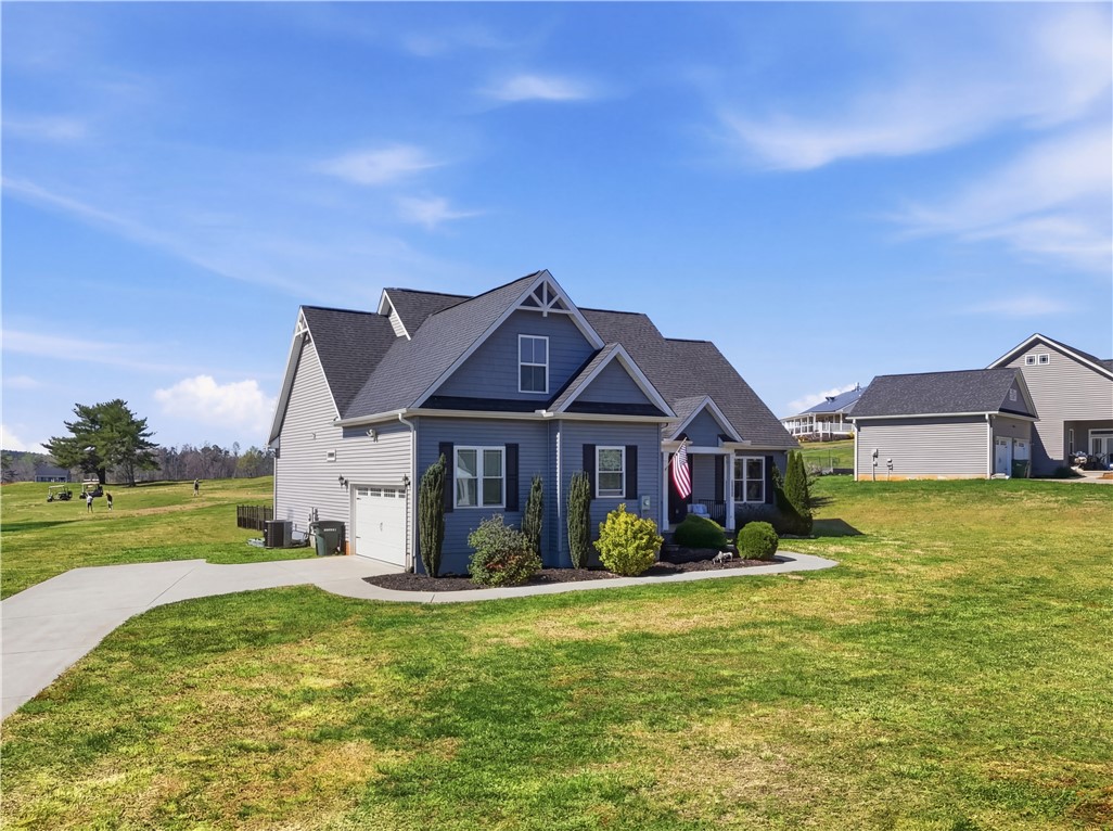 1312 Falcons Drive Walhalla, SC 29691 - Photo 3 of 34 This charming residence features a classic gable roof and attached garage, nestled in a spacious setting.