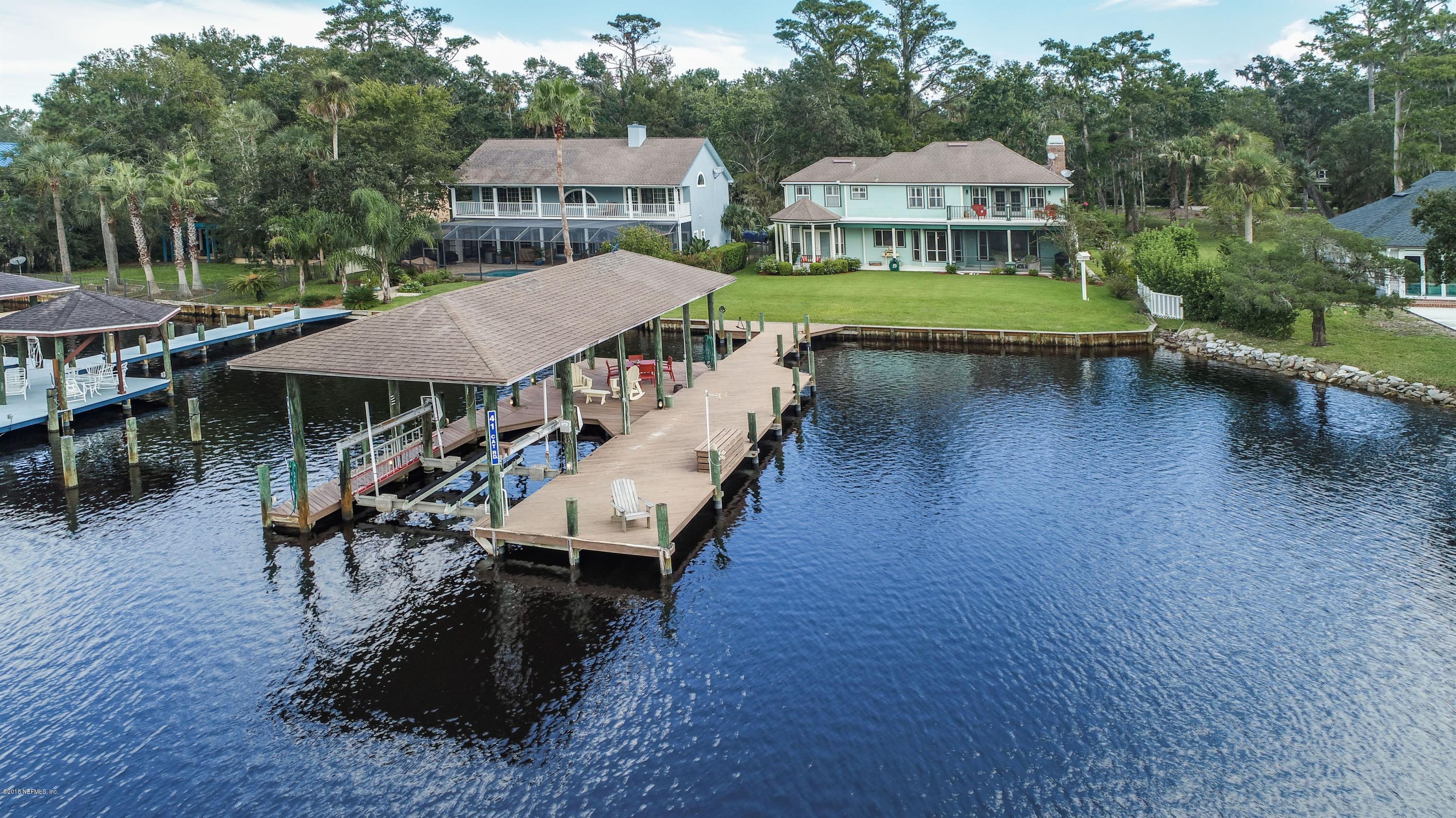 41 Cat Road Ponte Vedra Beach, FL 32082 - Photo 31 of 36 a view of a house with pool and chairs