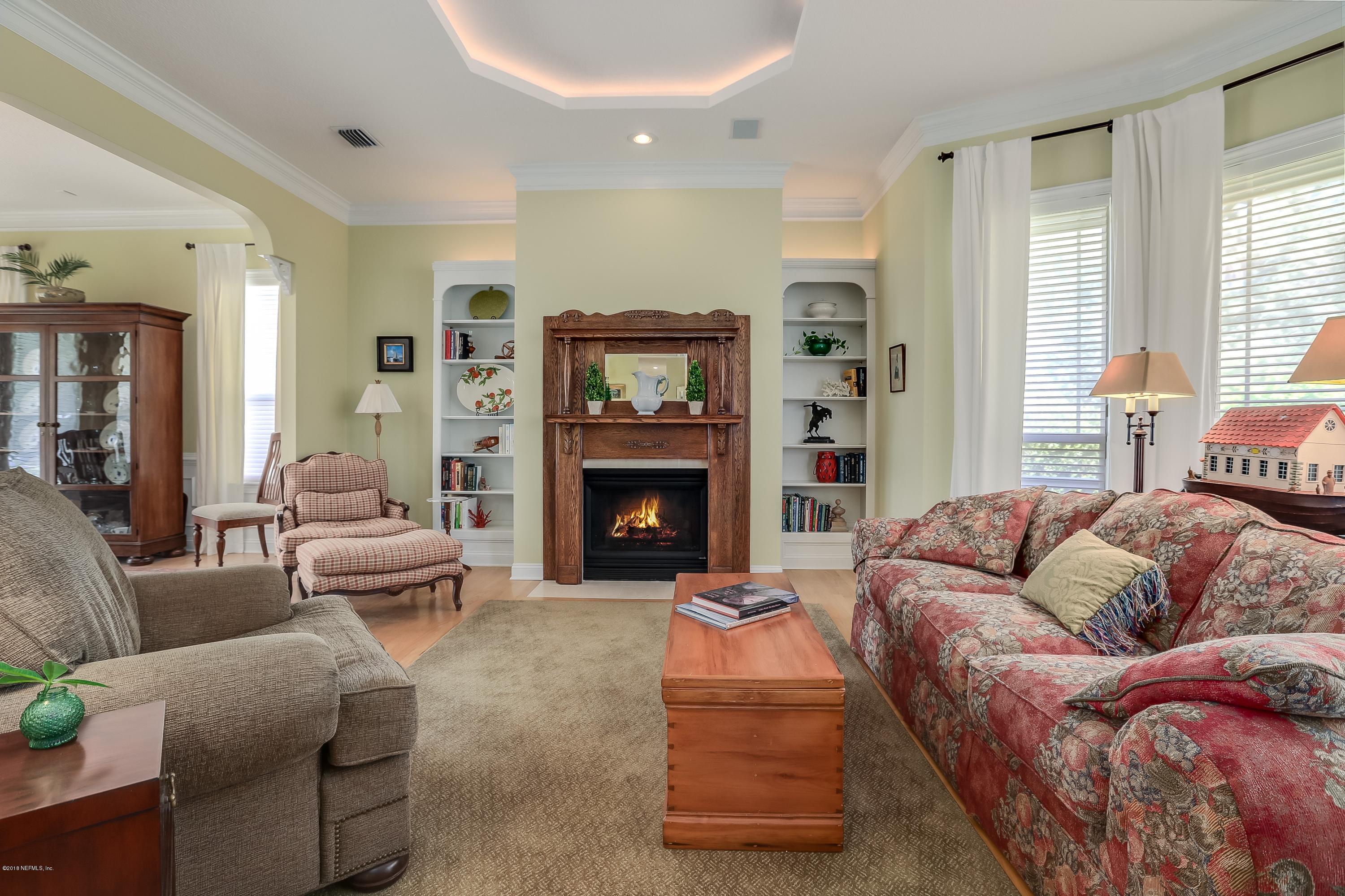 41 Cat Road Ponte Vedra Beach, FL 32082 - Photo 5 of 36 a living room with furniture and a fireplace