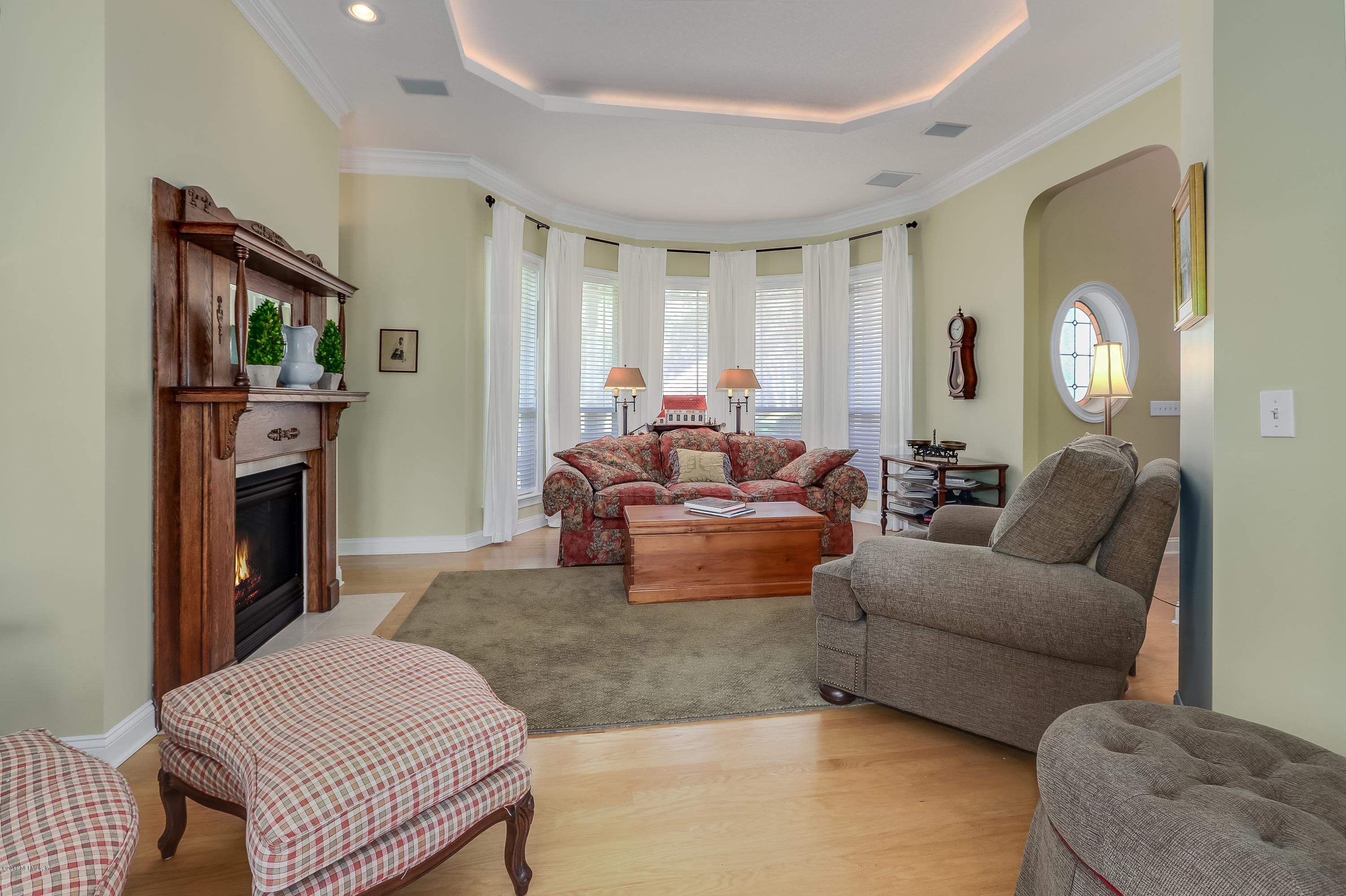 41 Cat Road Ponte Vedra Beach, FL 32082 - Photo 8 of 36 a living room with furniture a fireplace and a window