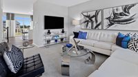 1059 Atterberg Road, Unit 4202 South Elgin, IL 60177 - Photo 3 of 18 a living room with furniture and a flat screen tv