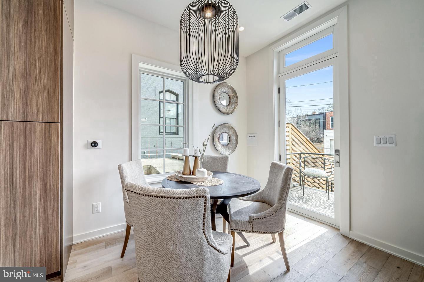 442.5 R Street Northwest, Unit B Washington, DC 20009 - Photo 10 of 25 a dining room with furniture and window