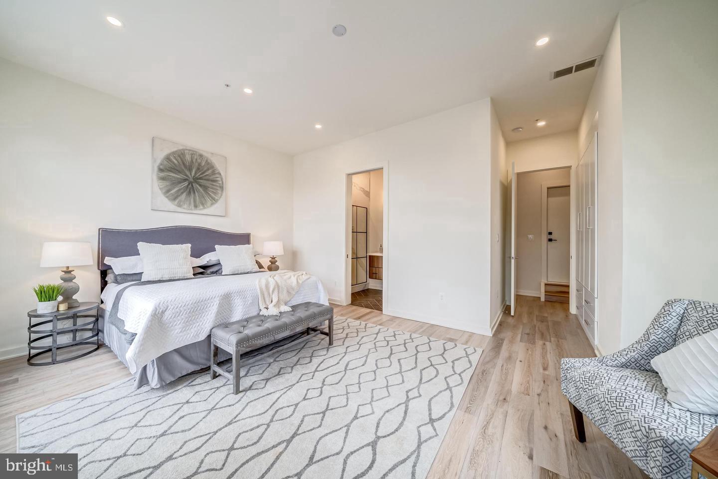 442.5 R Street Northwest, Unit B Washington, DC 20009 - Photo 13 of 25 a bedroom with a bed and a couch