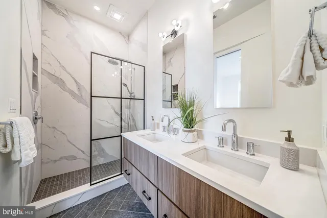 a bedroom with furniture and a large window