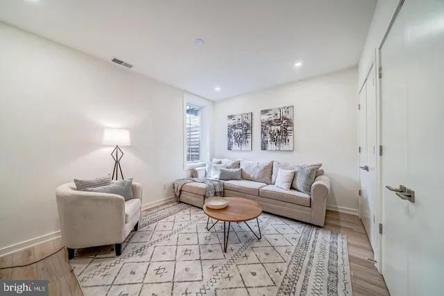 a workspace with wooden floor and a window