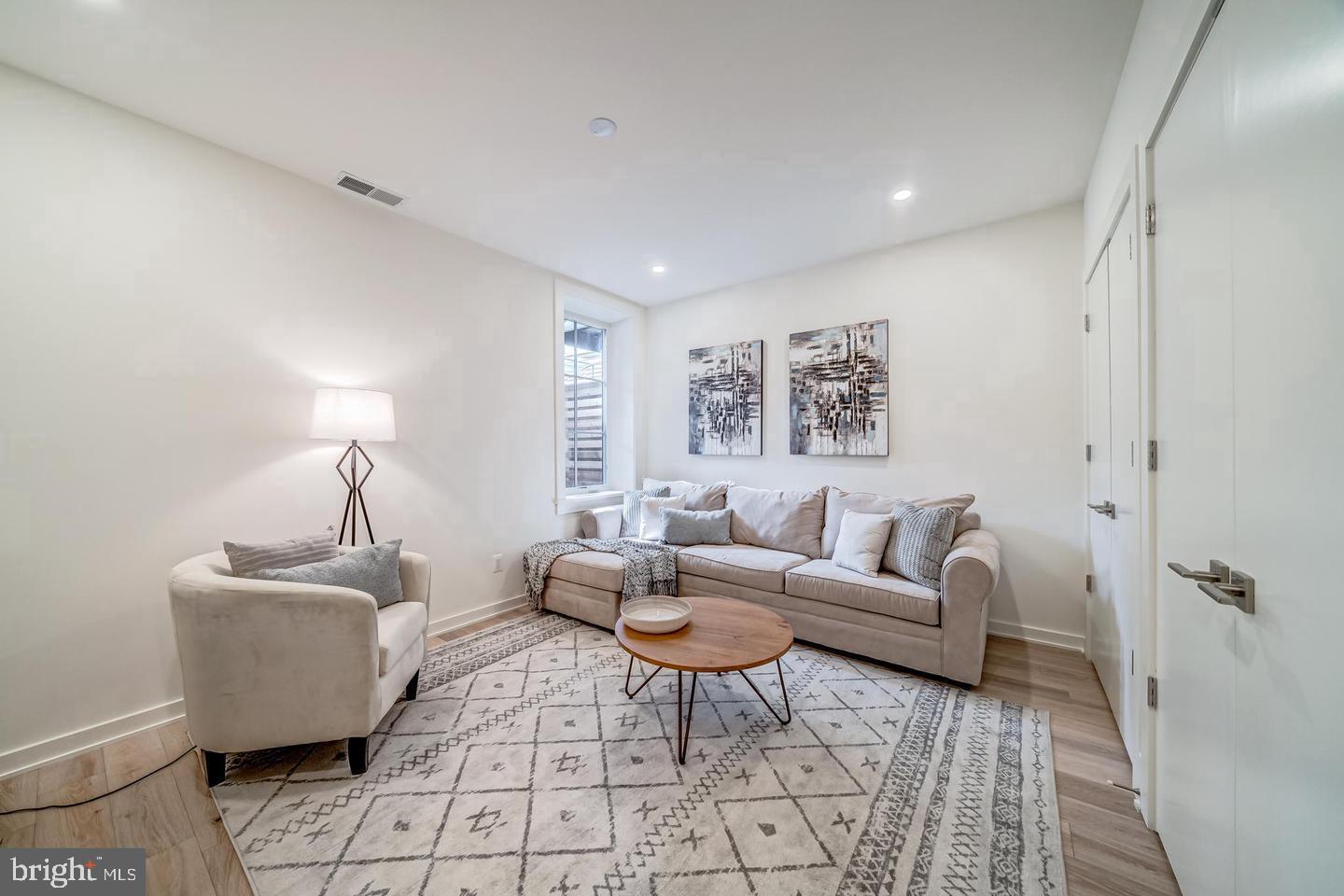 442.5 R Street Northwest, Unit B Washington, DC 20009 - Photo 19 of 25 a living room with furniture and a window