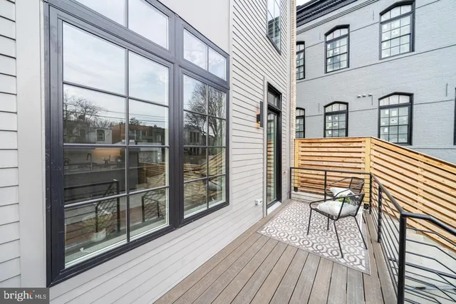 a view of a balcony with wooden floor