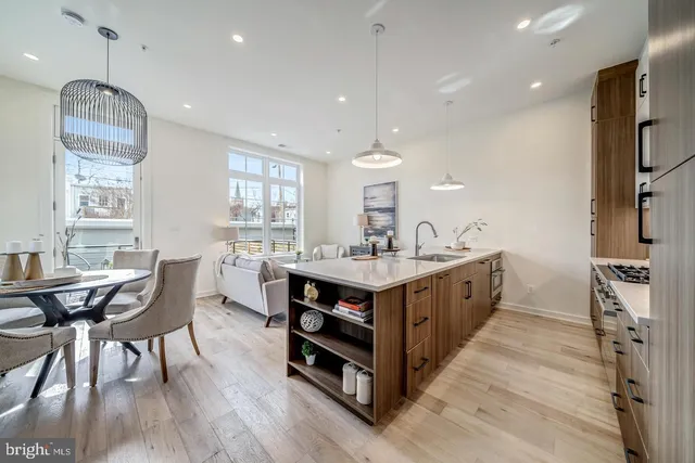 a kitchen with sink cabinets and wooden floor