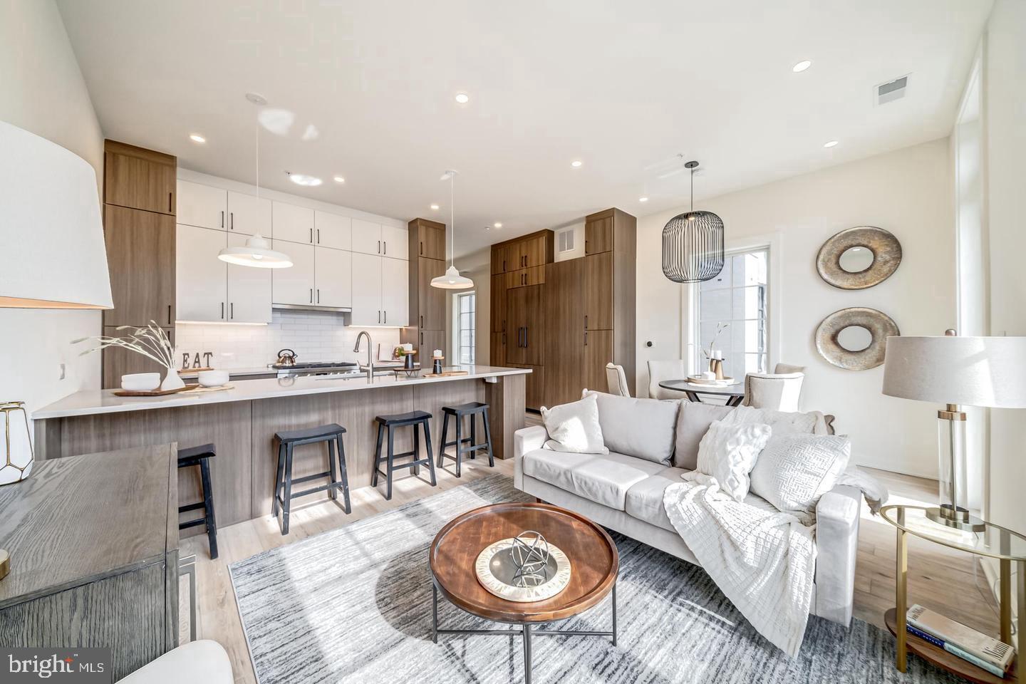 442.5 R Street Northwest, Unit B Washington, DC 20009 - Photo 24 of 25 a living room with furniture a rug and kitchen view