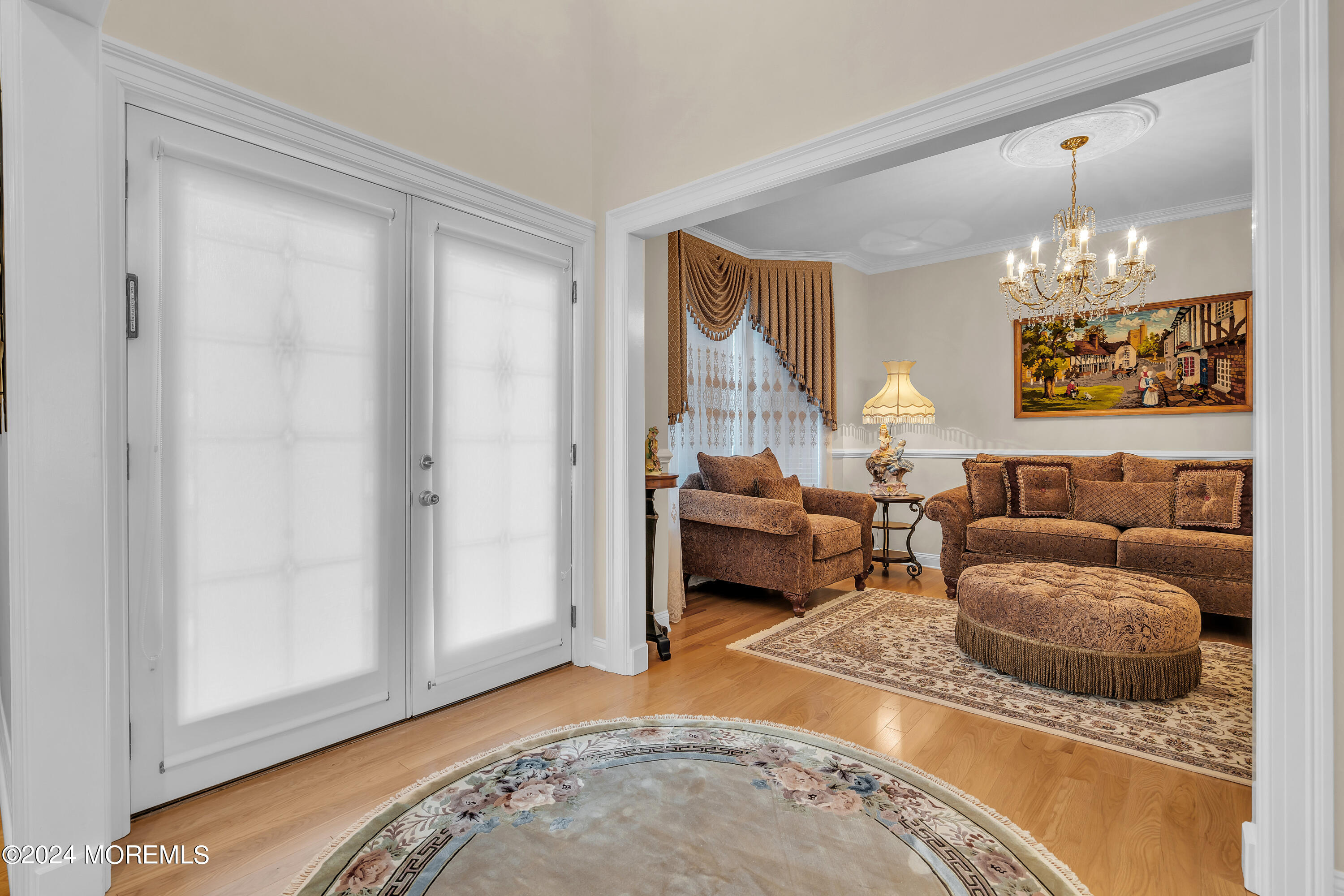 2050 MacKenzie Road Toms River, NJ 08755 - Photo 15 of 95 a living room with furniture and a chandelier