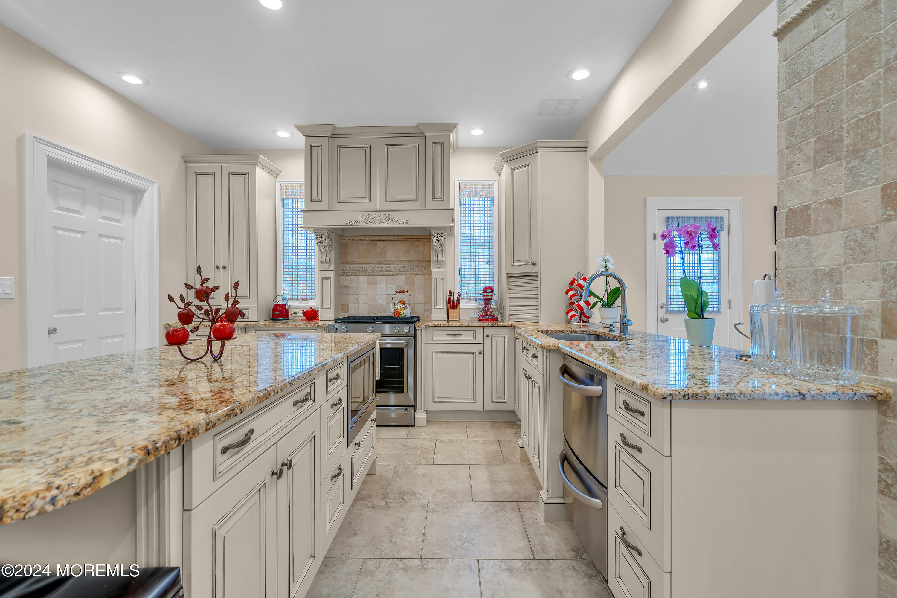 2050 MacKenzie Road Toms River, NJ 08755 - Photo 27 of 95 a kitchen with stainless steel appliances granite countertop a sink stove and cabinets