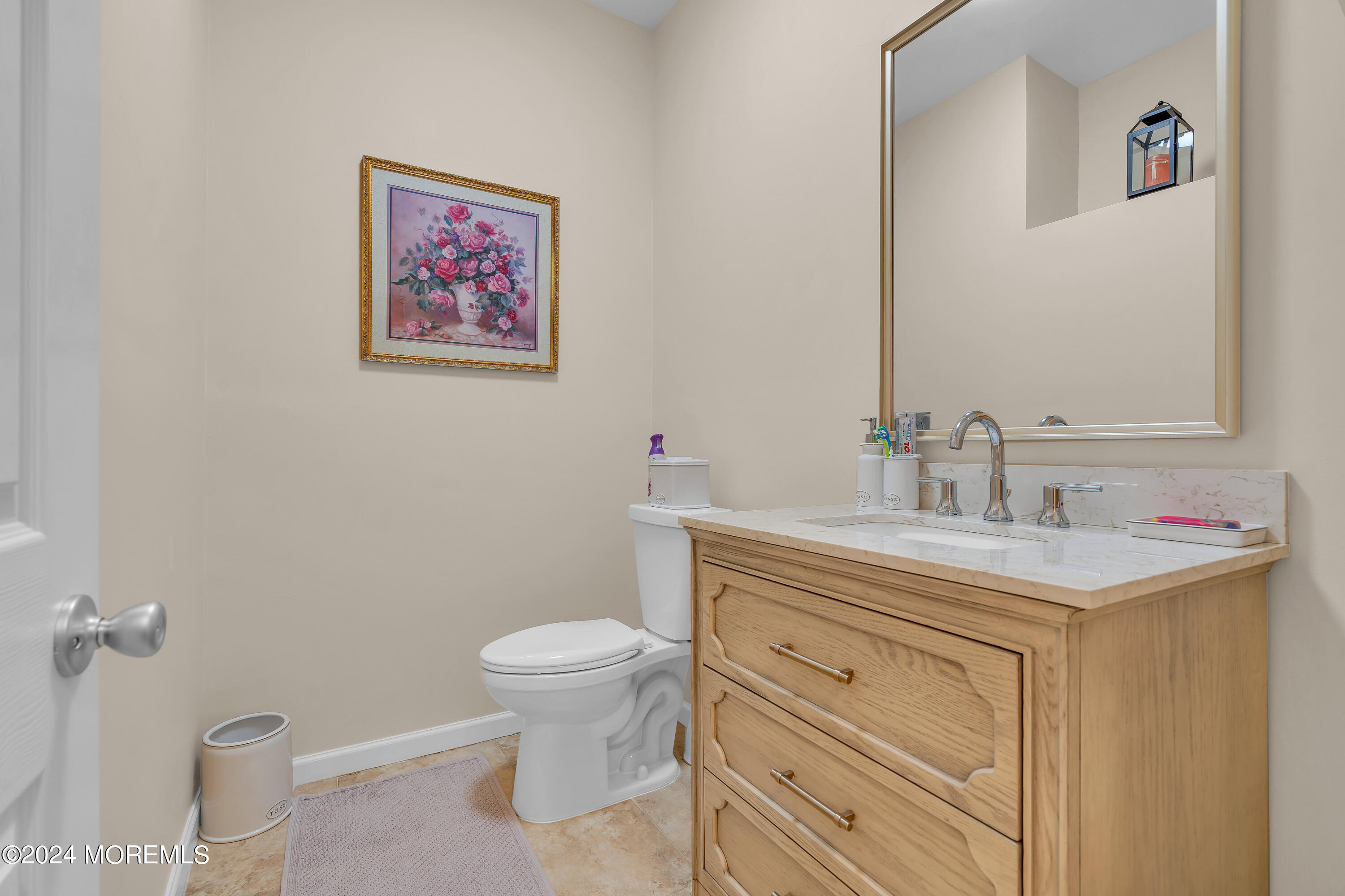 2050 MacKenzie Road Toms River, NJ 08755 - Photo 42 of 95 a bathroom with a toilet sink vanity and mirror