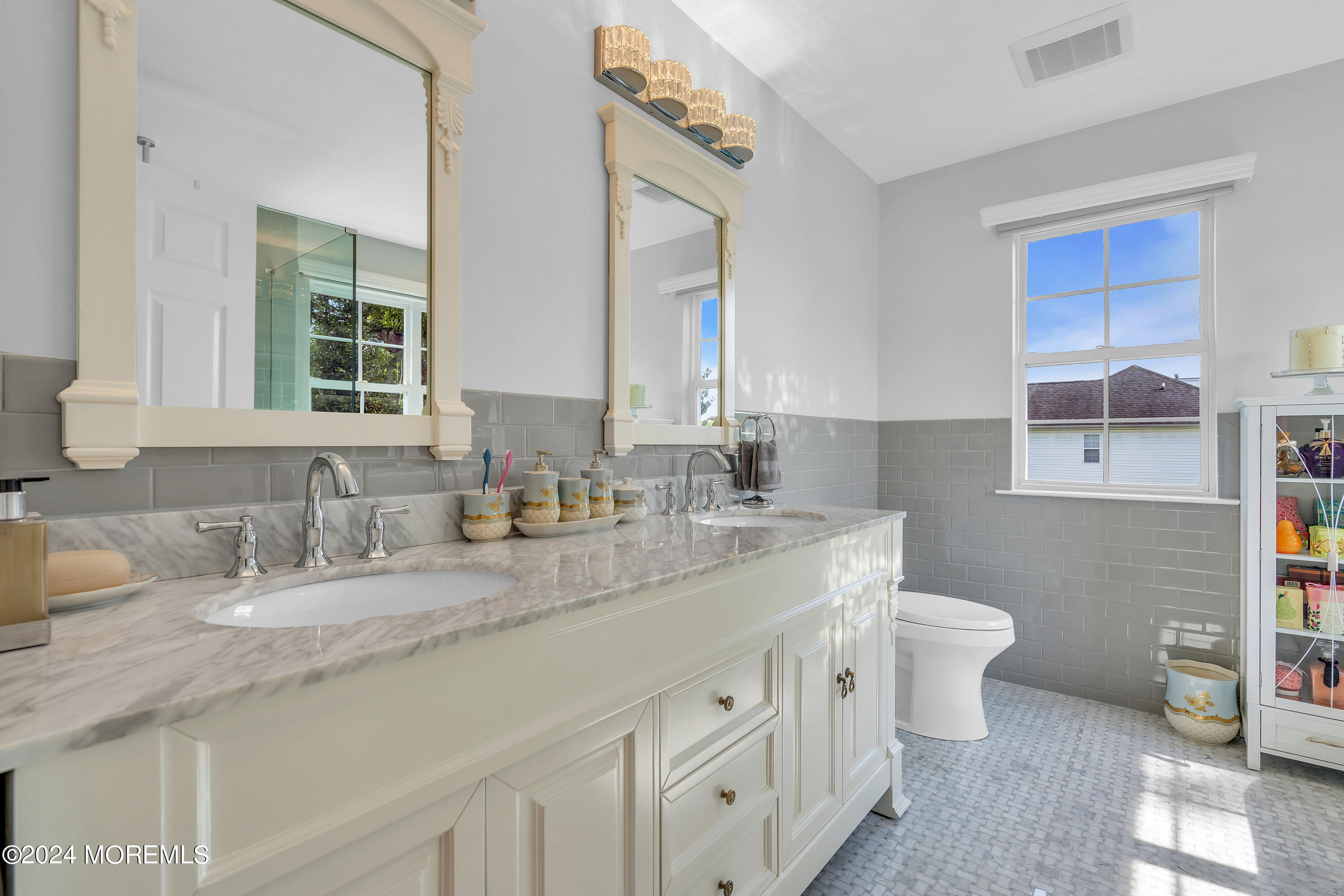 2050 MacKenzie Road Toms River, NJ 08755 - Photo 56 of 95 a bathroom with double vanity sink a mirror and a toilet