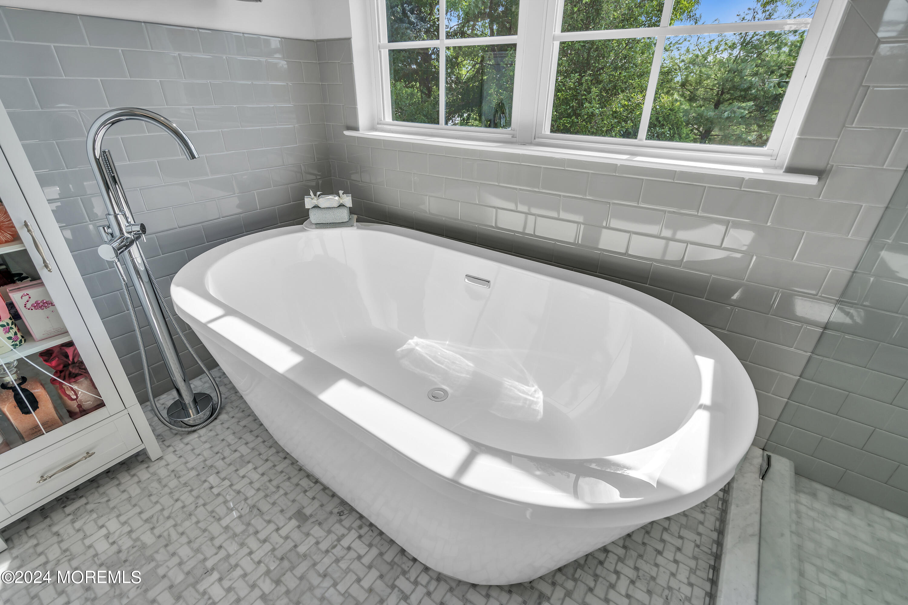 2050 MacKenzie Road Toms River, NJ 08755 - Photo 58 of 95 a white bath tub sitting in a bathroom