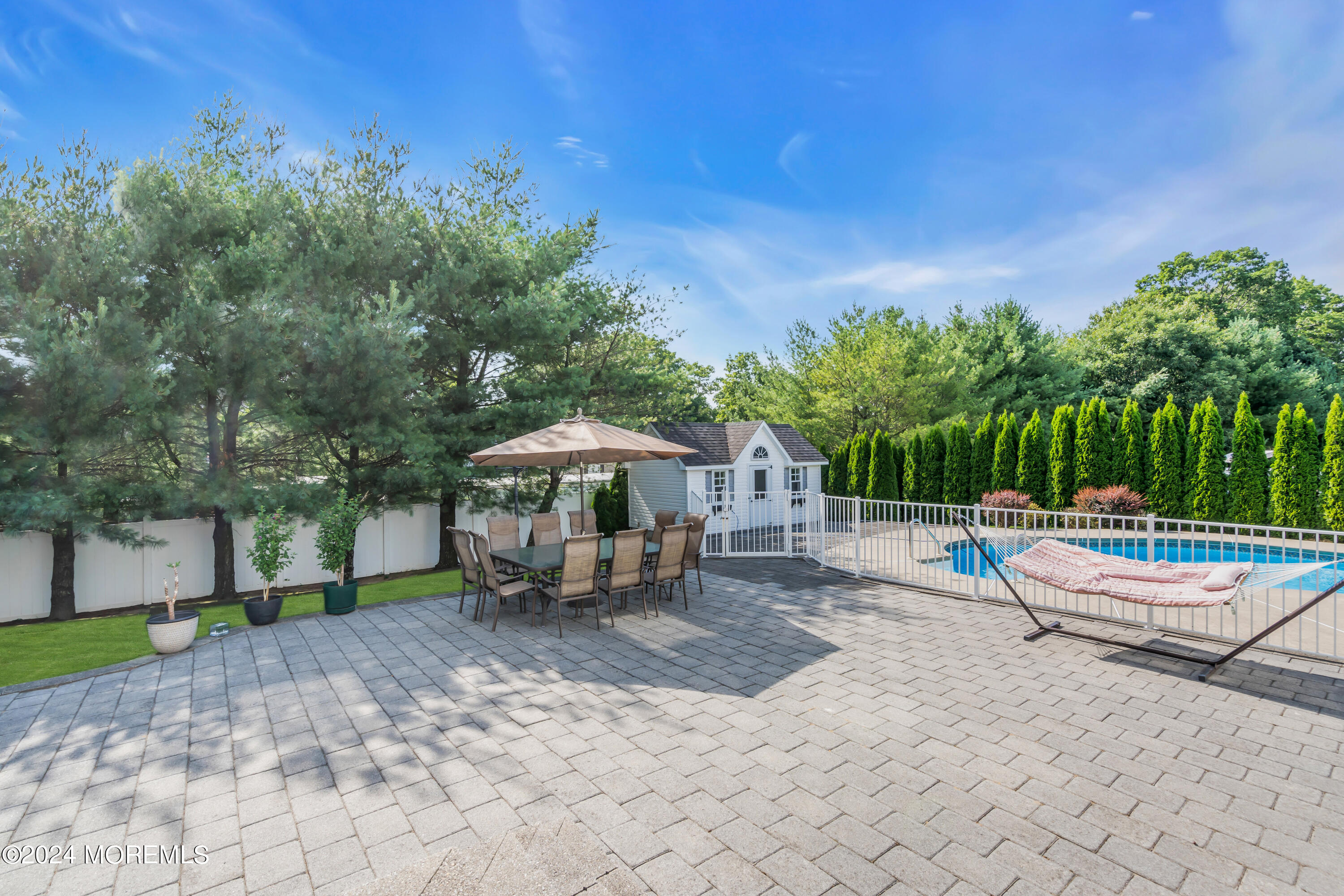 2050 MacKenzie Road Toms River, NJ 08755 - Photo 73 of 95 a view of a patio with a dining table and chairs with wooden fence