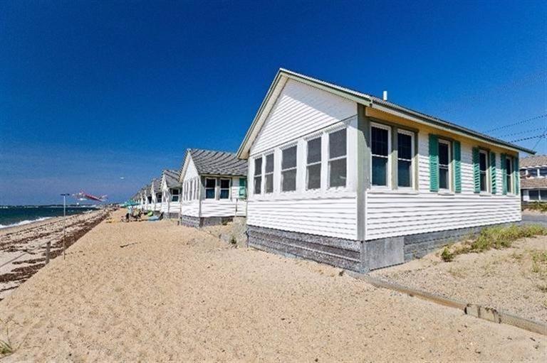 276 Shore Road, Unit 2 Truro, MA 02666 - Photo 4 of 12 a front view of a house with a yard