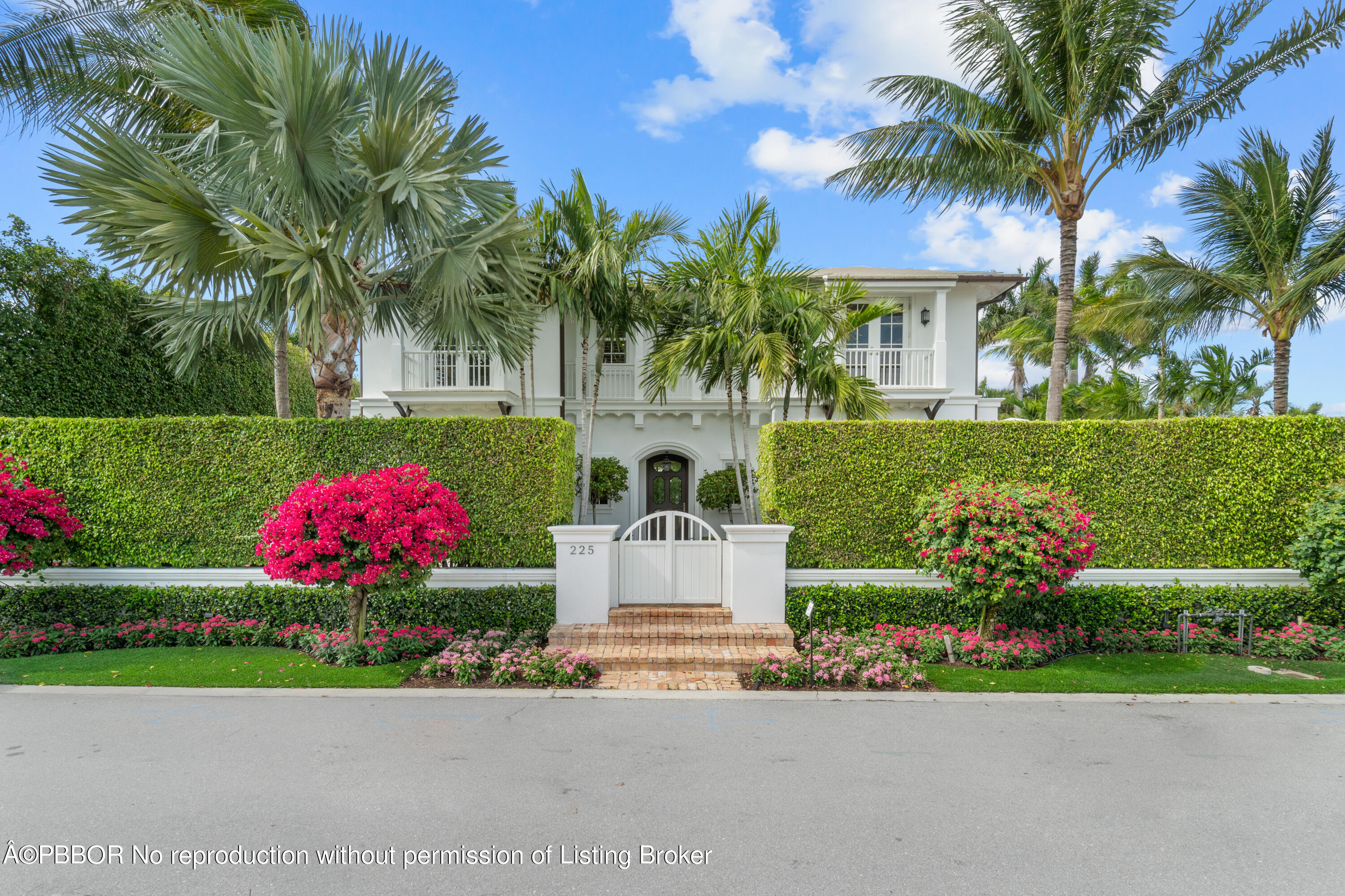 225 Plantation Road Palm Beach, FL 33480 - Photo 1 of 27 a front view of a house with a yard and outdoor seating