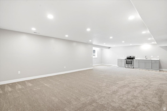 2973 West Red Sand Rd Haven Ogden, UT 84401 - Photo 18 of 30 Expansive open-concept room featuring neutral-toned carpeting and recessed lighting