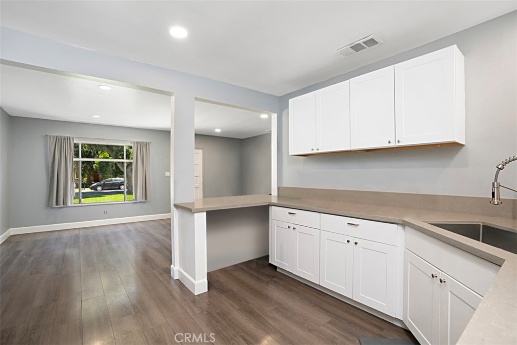 3076 Ronald Street Riverside, CA 92506 - Photo 15 of 26 a view of cabinets and wooden floor