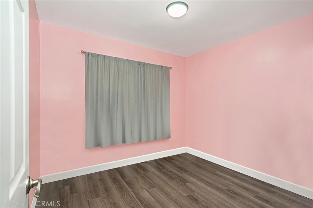 3076 Ronald Street Riverside, CA 92506 - Photo 17 of 26 a view of an empty room with wooden floor