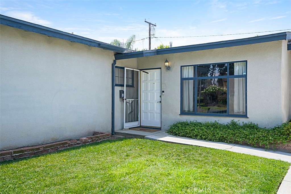 3076 Ronald Street Riverside, CA 92506 - Photo 6 of 26 a front view of a house having yard