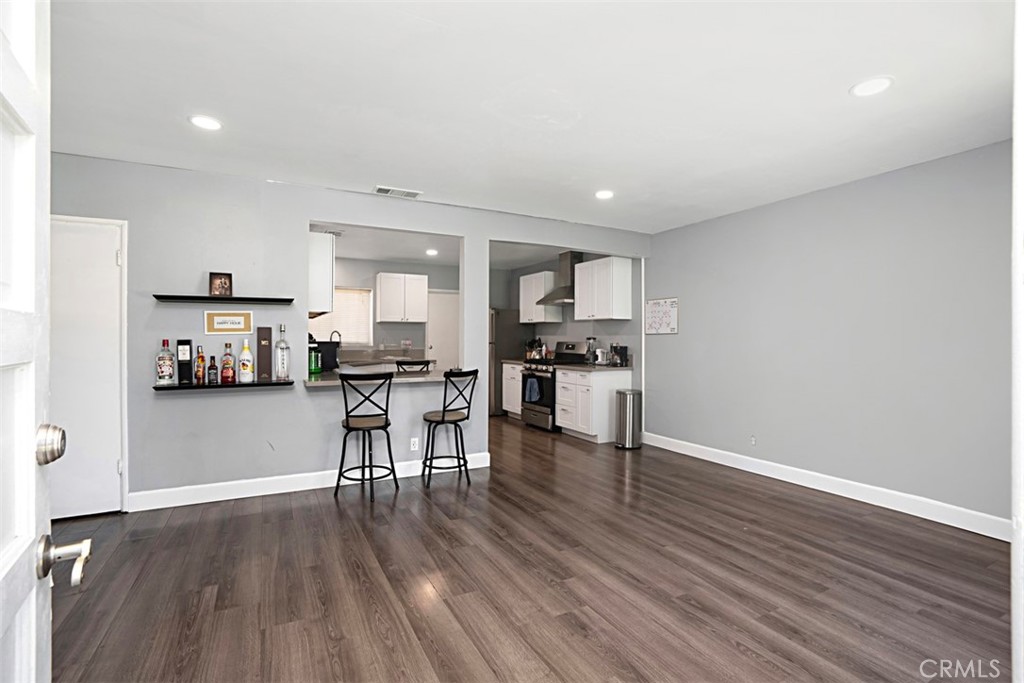 3076 Ronald Street Riverside, CA 92506 - Photo 8 of 26 a kitchen with a table and chairs