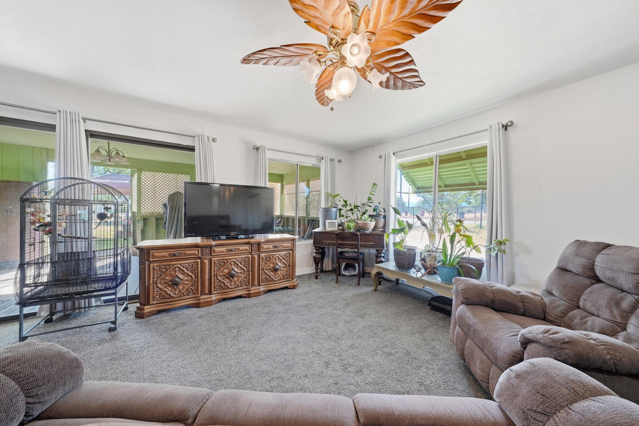22189 Old Alturas Road Redding, CA 96003 - Photo 25 of 70 a living room with furniture and a flat screen tv