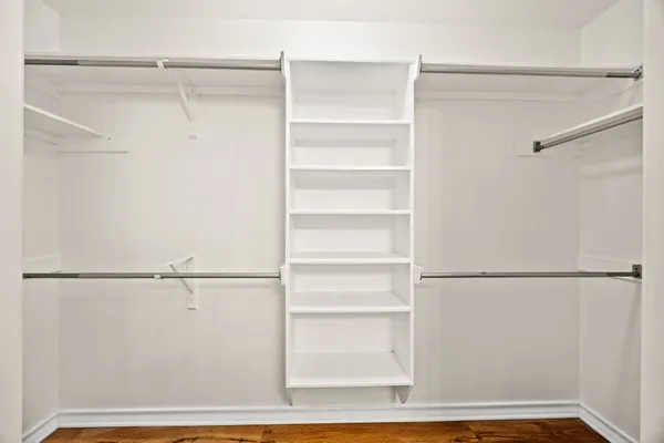 a view of an empty walk in closet