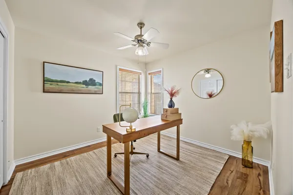 a view of a livingroom with furniture and wooden floor