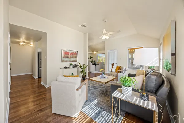 a living room with furniture and a large window