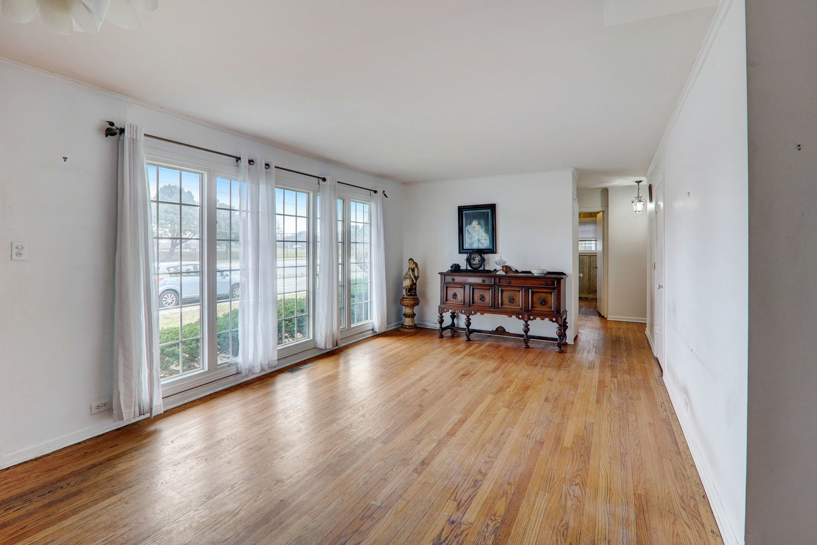 7125 Simpson Street Morton Grove, IL 60053 - Photo 15 of 28 a living room with furniture and a wooden floor