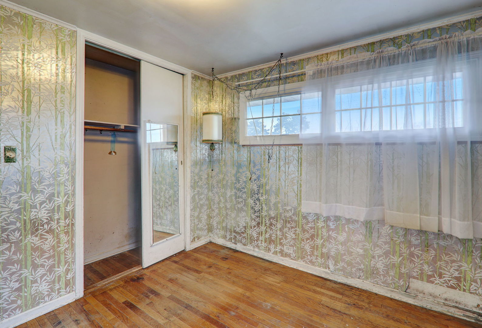 7125 Simpson Street Morton Grove, IL 60053 - Photo 17 of 28 a view of empty room with wooden floor and cabinet