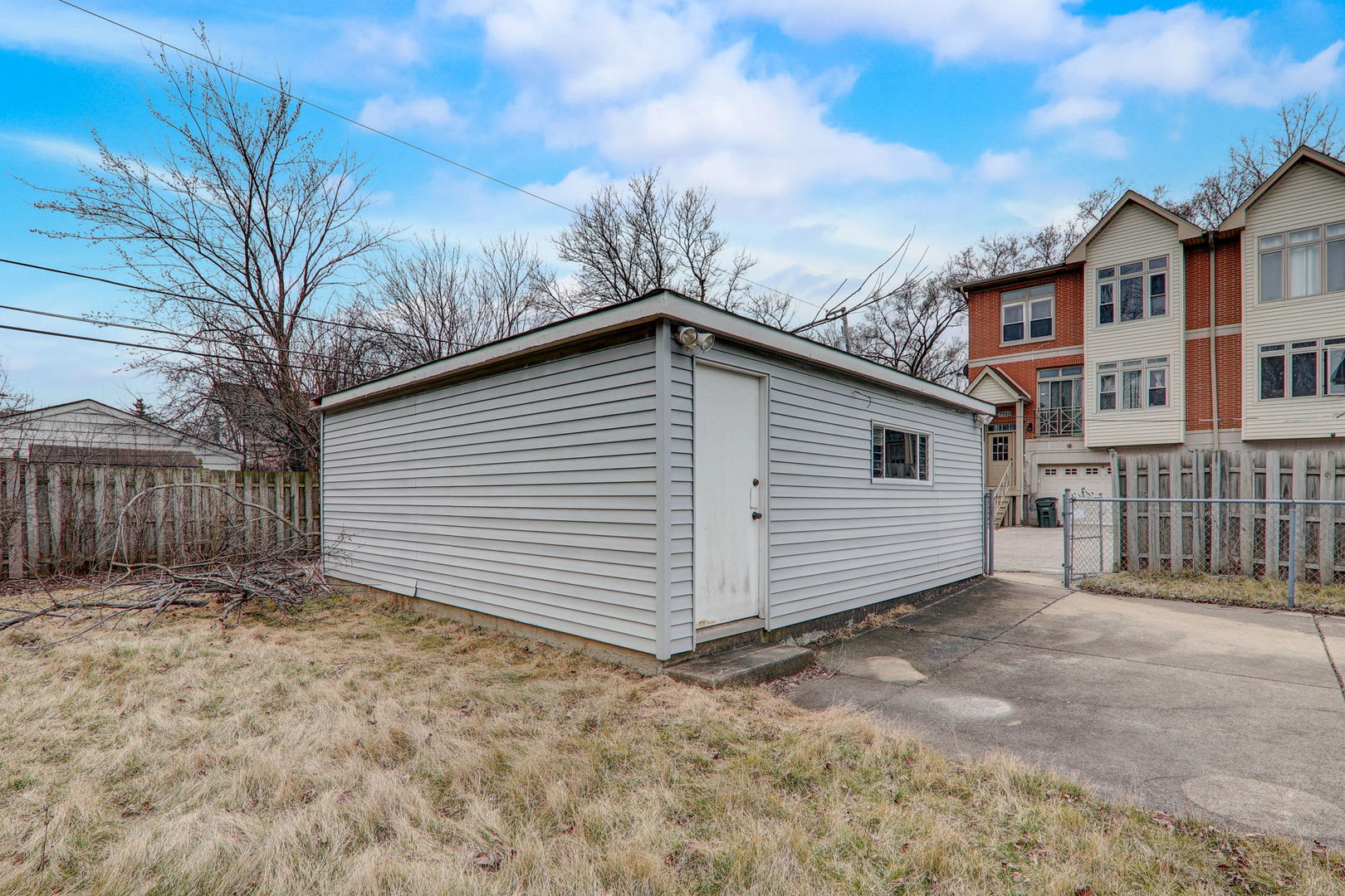 7125 Simpson Street Morton Grove, IL 60053 - Photo 24 of 28 a view of a house with a yard and fence