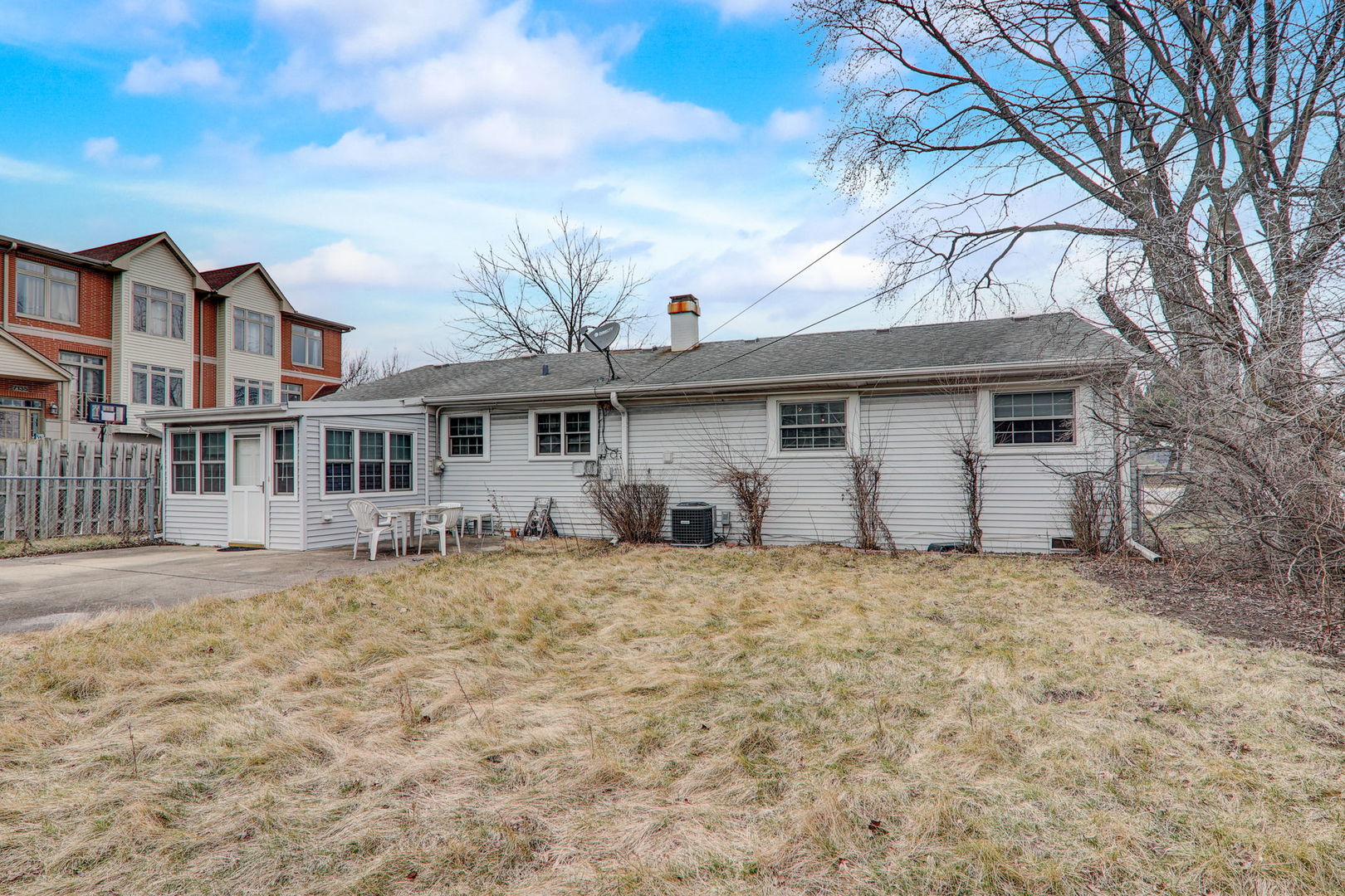 7125 Simpson Street Morton Grove, IL 60053 - Photo 26 of 28 a view of a yard in front of a house with large tree