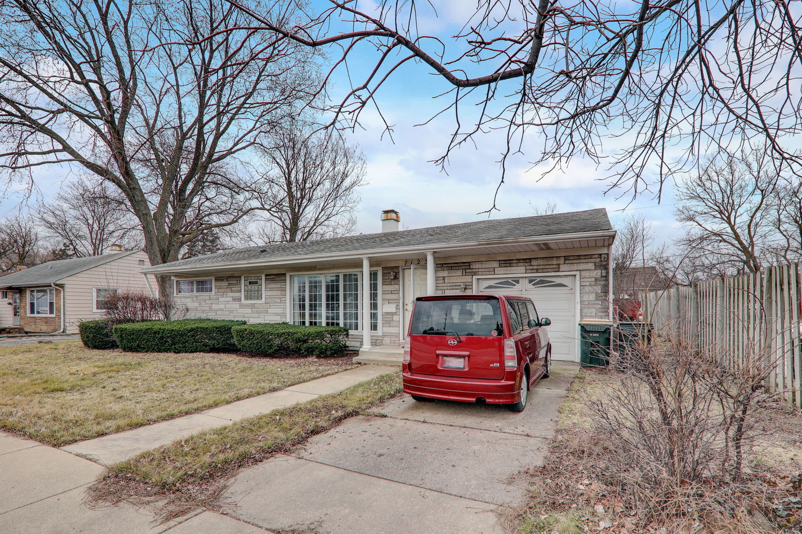 7125 Simpson Street Morton Grove, IL 60053 - Photo 5 of 28 a car parked in front of white house