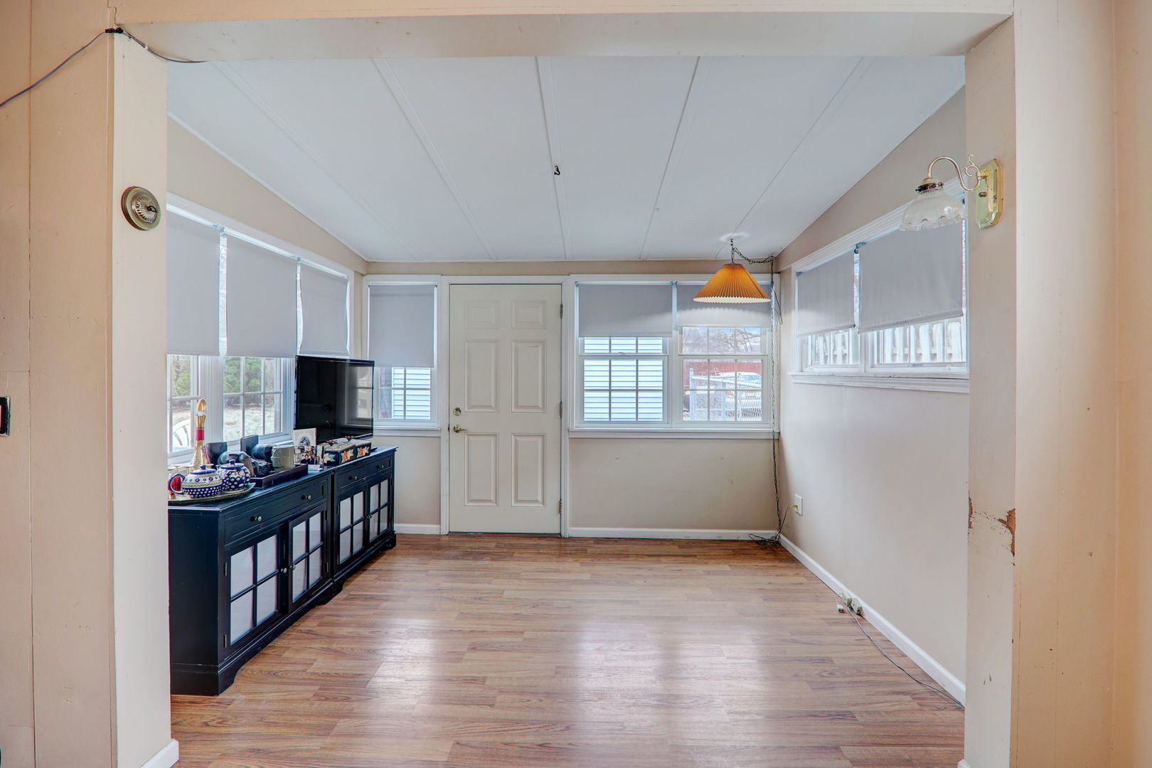 7125 Simpson Street Morton Grove, IL 60053 - Photo 8 of 28 a view of a kitchen with kitchen island wooden floor and electronic appliances