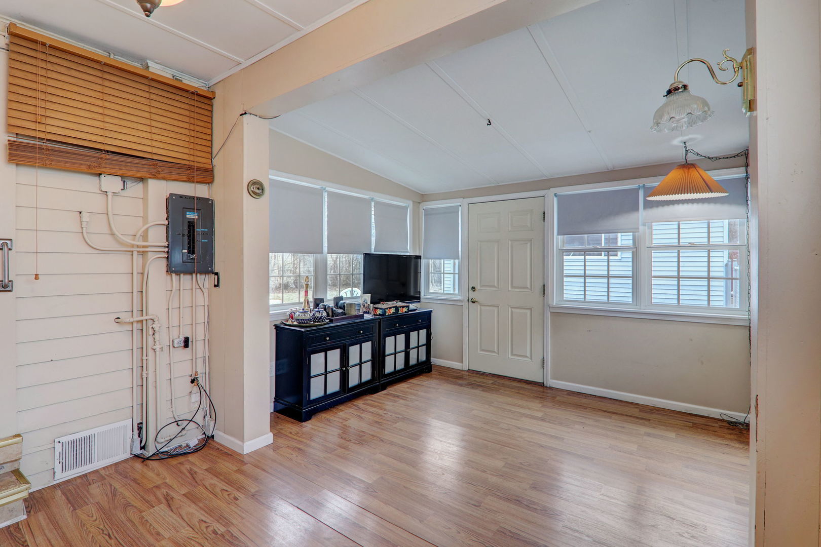 7125 Simpson Street Morton Grove, IL 60053 - Photo 10 of 28 a view of empty room with wooden floor and fan